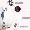 A brown wooden coat rack with a hat and jacket on it, with callouts highlighting its features. Náhľad obrázku produktu