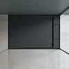 A minimalist interior with a dark gray wall and a light gray floor. Produktbild-Vorschau