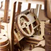 Close-up view of the interior of a wooden model tractor, focusing on the steering wheel and dashboard. Anteprima dell’immagine prodotto