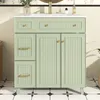 A light green bathroom vanity with gold hardware is shown in a well-lit room with tiled walls and floor. Anteprima dell’immagine prodotto