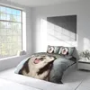 A bedroom scene with a bed featuring a duvet cover and pillowcases with a husky dog print. Produktbild-Vorschau