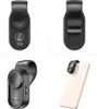A collage of four images showing a black clip-on microscope for a smartphone, demonstrating its design, attachment mechanism, and use. Produktbild-Vorschau