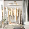 A well-organized closet with clothes on a rack and shoes on the floor. Produktbild-Vorschau