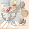Two children playing on a wooden climbing structure indoors. Voir les images du produit