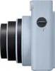 Side view of a light blue instant camera with a black lens. Anteprima dell’immagine prodotto