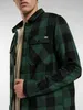 A man wearing a green and black checkered shirt. Podgląd zdjęcia produktu