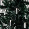 A close-up view of a string of LED candle lights attached to a Christmas tree. Produktbild-Vorschau