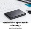 A black external hard drive is placed on a white desk next to a keyboard and a mouse. Produktbild-Vorschau