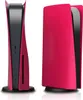 Two views of a pink and black PlayStation 5 disc version console with protective covers. Produktbild-Vorschau