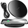 A black wireless charging pad with a USB cable and a smartphone on it, showing the charging indicator. Produktbild-Vorschau