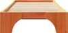 A close-up, straight-on view of a wooden bed frame with a slatted base. Produktbild-Vorschau