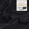 A close-up of black fabric with a label attached. Produktbild-Vorschau