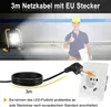 A construction worker giving a thumbs up next to a portable LED work light, with a close-up of a power cord and EU socket. Produktbild-Vorschau
