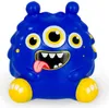 A blue, three-eyed monster toy with yellow feet and yellow spots. Voir les images du produit