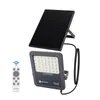 A solar floodlight with a separate solar panel and a remote control, displayed against a white background. Produktbild-Vorschau
