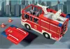 A toy fire truck with accessories on a city-like background. Produktbild-Vorschau