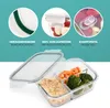 A glass food container with three compartments, filled with food, and close-up insets showing product features. Náhled obrázku produktu