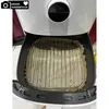The inside of an air fryer with a rack and parchment paper. Produktbild-Vorschau
