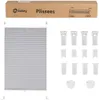A product shot of a grey pleated blind and its accessories, with packaging in the background. Produktbild-Vorschau