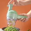 A person is using a green electric vegetable cutter to slice green peppers into a bowl. Náhled obrázku produktu