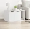 A white cabinet with two doors and an open shelf next to a sofa. Produktbild-Vorschau