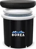 A black inflatable tub with a white rim, filled with water, and a black cover on top. The tub has a logo with mountains and the word 'BOREA' on it. Produktbild-Vorschau