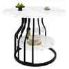 A round dining table with a marble-effect top and a black metal base, featuring a lower shelf for storage. It is set with a bottle of wine, wine glasses, and a stack of plates. Náhľad obrázku produktu