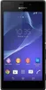 A front-on view of a black Sony Xperia M2 smartphone displaying its home screen with various app icons.