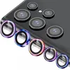 A close-up view of multiple colorful camera lens protectors arranged in front of a smartphone's camera array. Anteprima dell’immagine prodotto