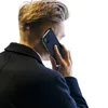 A person is holding a phone to their ear, with the phone case visible. Náhled obrázku produktu