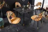 A dining room setting with a marble-top table and four chairs. Produktbild-Vorschau