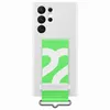 A white Samsung phone case with a green and white patterned strap attached. Podgląd zdjęcia produktu