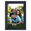 A family is posing for a photo in a digital picture frame. Produktbild-Vorschau