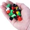 A hand holding a pile of colorful plastic automotive clips. Podgląd zdjęcia produktu