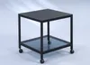 A black metal side table with a glass shelf and wheels, shown against a light gray background. Produktbild-Vorschau