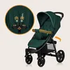 A green LIONELO Annet Buggy is shown with a close-up inset highlighting the harness. Náhled obrázku produktu
