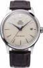A close-up studio shot of an Orient automatic watch with a cream dial and a brown leather strap. Voir les images du produit