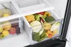 A close-up view of the interior of a refrigerator, showing produce in drawers. Produktbild-Vorschau