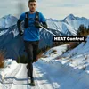 A man is running on a snowy mountain path. Produktbild-Vorschau
