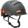 A gray bicycle helmet with integrated orange lights. Náhled obrázku produktu