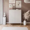 A modern living room with a white cabinet, artwork, and decorative items. Produktbild-Vorschau