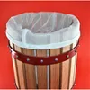 A close-up view of the top of a wooden bucket with a white mesh liner, against a red background. Produktbild-Vorschau