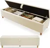 A beige upholstered storage bench with its lid open, showing items stored inside. Anteprima dell’immagine prodotto