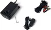 A black electronic device with a dial and switch, along with a power adapter and a coiled cable with alligator clips, are arranged on a white background. Produktbild-Vorschau