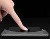 A finger is pressing on a smartphone screen with a screen protector applied. Podgląd zdjęcia produktu