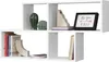 A white wall shelf unit with books and decorative items. Produktbild-Vorschau