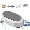 A collage featuring an ultrasonic cleaner and various items that can be cleaned with it, such as dentures, glasses, jewelry, and a watch. Produktbild-Vorschau