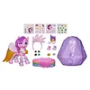 A toy set with a pink pony figure, accessories, and a purple crystal-shaped container, laid out on a white background. Náhľad obrázku produktu