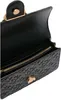 A close-up view of the interior of a black handbag. Náhled obrázku produktu