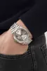 A person wearing a watch on their wrist, with their hand in their jeans pocket. Náhled obrázku produktu